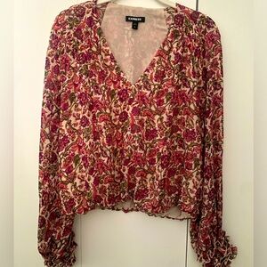 Express floral blouse; V-neck with ruffled hemmed cuffs